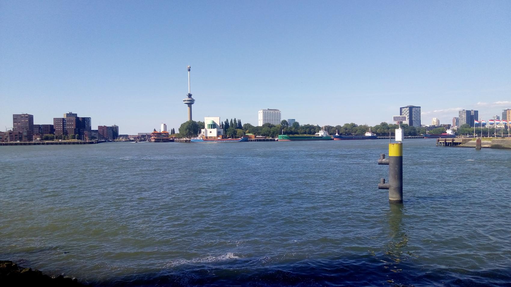 A view across Maas at the tunnel location. Low white building in the centre of the picture contains the exit on the other side.